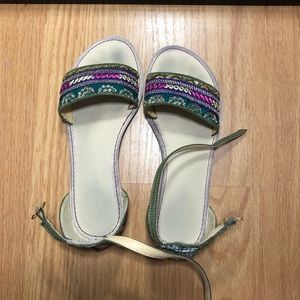 green & gold single strap with buckle sandals.